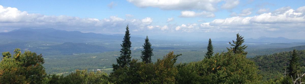 vista of valley and distant mountains - taken from mountaintop