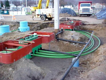 Photo of underground storage tank with flexible pipe installation.