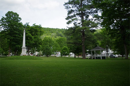 Rochester village green with a gazebo and a monument
