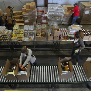 Employees working at a food bank, as seen from a bird's eye view. 