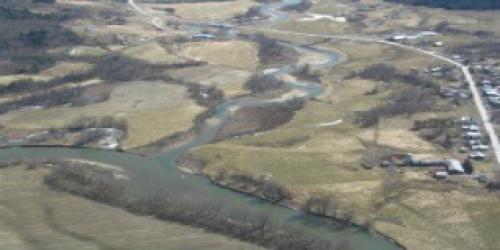 Aerial view of river and surrounding fields