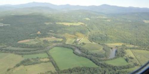 Aerial view of river and surrounding fields