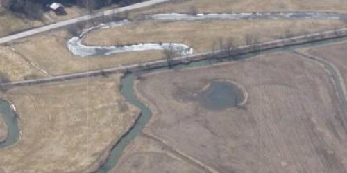 Aerial view of river and surrounding fields