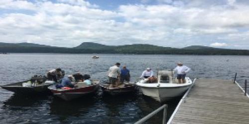 4 boats tied up at a public access dock