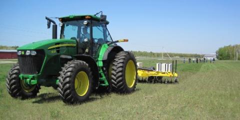 Tractor in field with blue sky