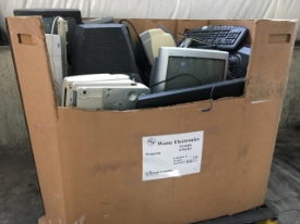 Photo of a large cardboard box containing television monitors for E-waste collection