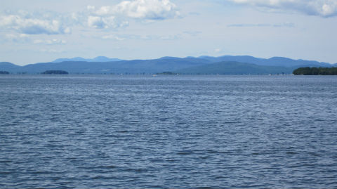 A view of Lake Champlain with mountains in background