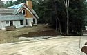 a home under construction and the drive approaching the site