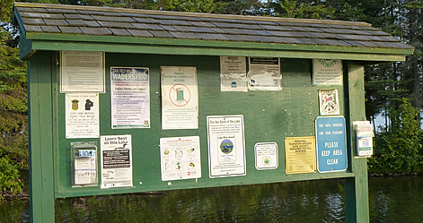 Bulletin Board holding numerous lake information postings