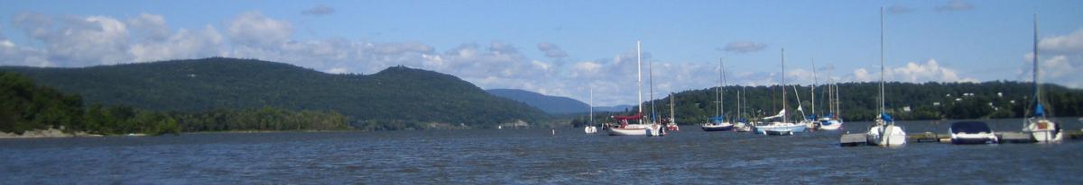 several sailboats moored on lake champlain