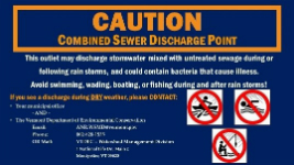 CSO Caution Sign.  A blue sign with large orange letters stating CAUTION Combined Sewer Discharge Point