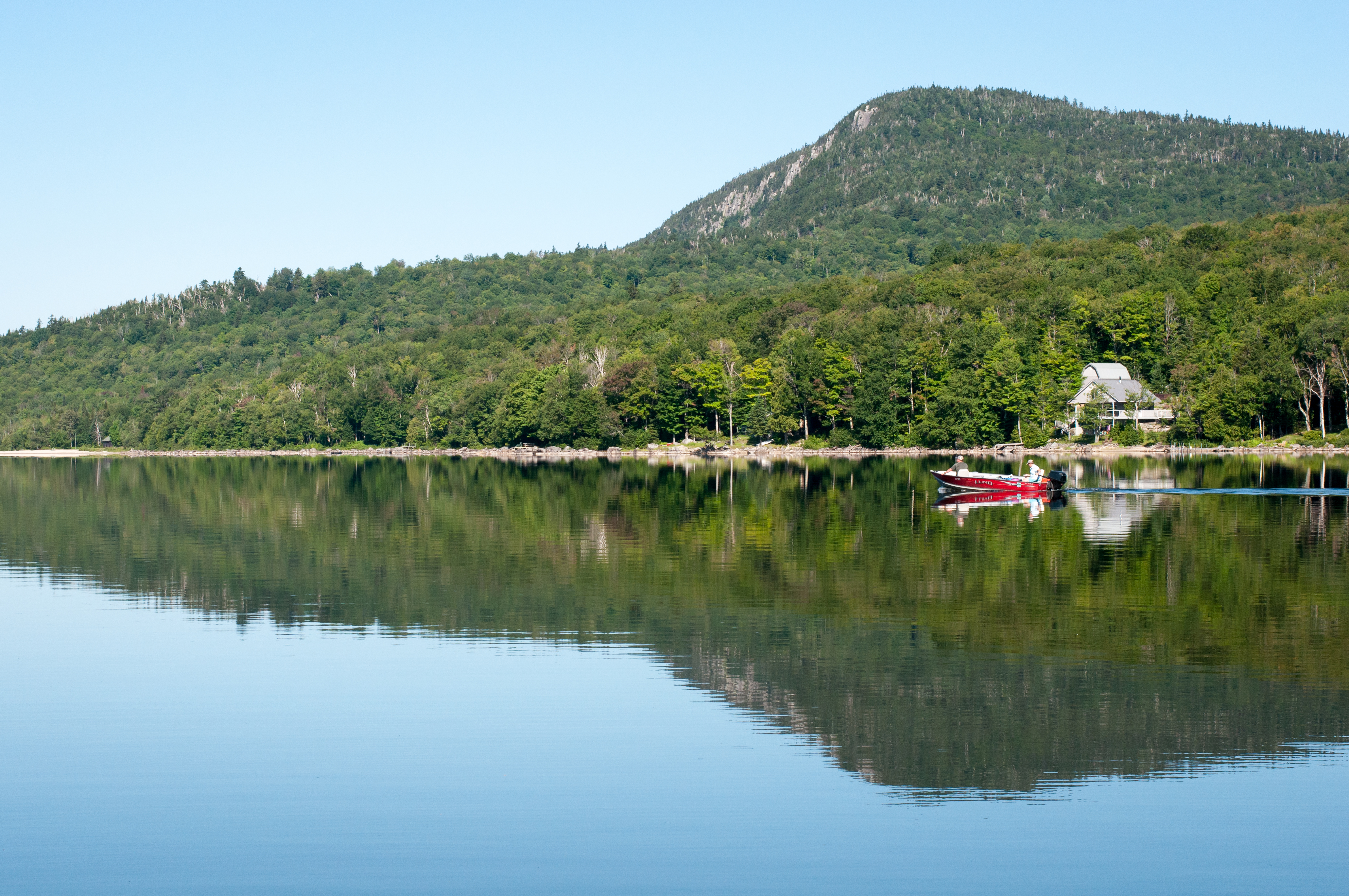 A lake with a boat for collecting watersamples.